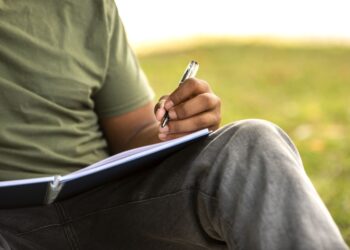 Studant writing down - English Writing for Daily Practice